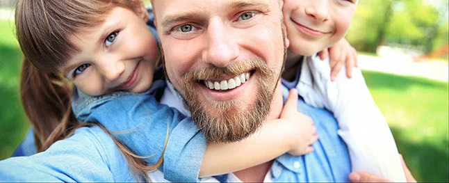 Happy family taking selfie in the park